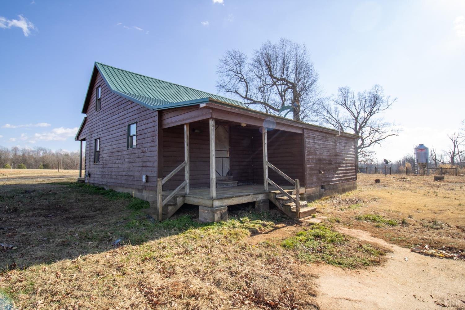 3039 T N Snow Road Nathalie, VA 24577 - Photo 28 of 50 a view of a house with a yard