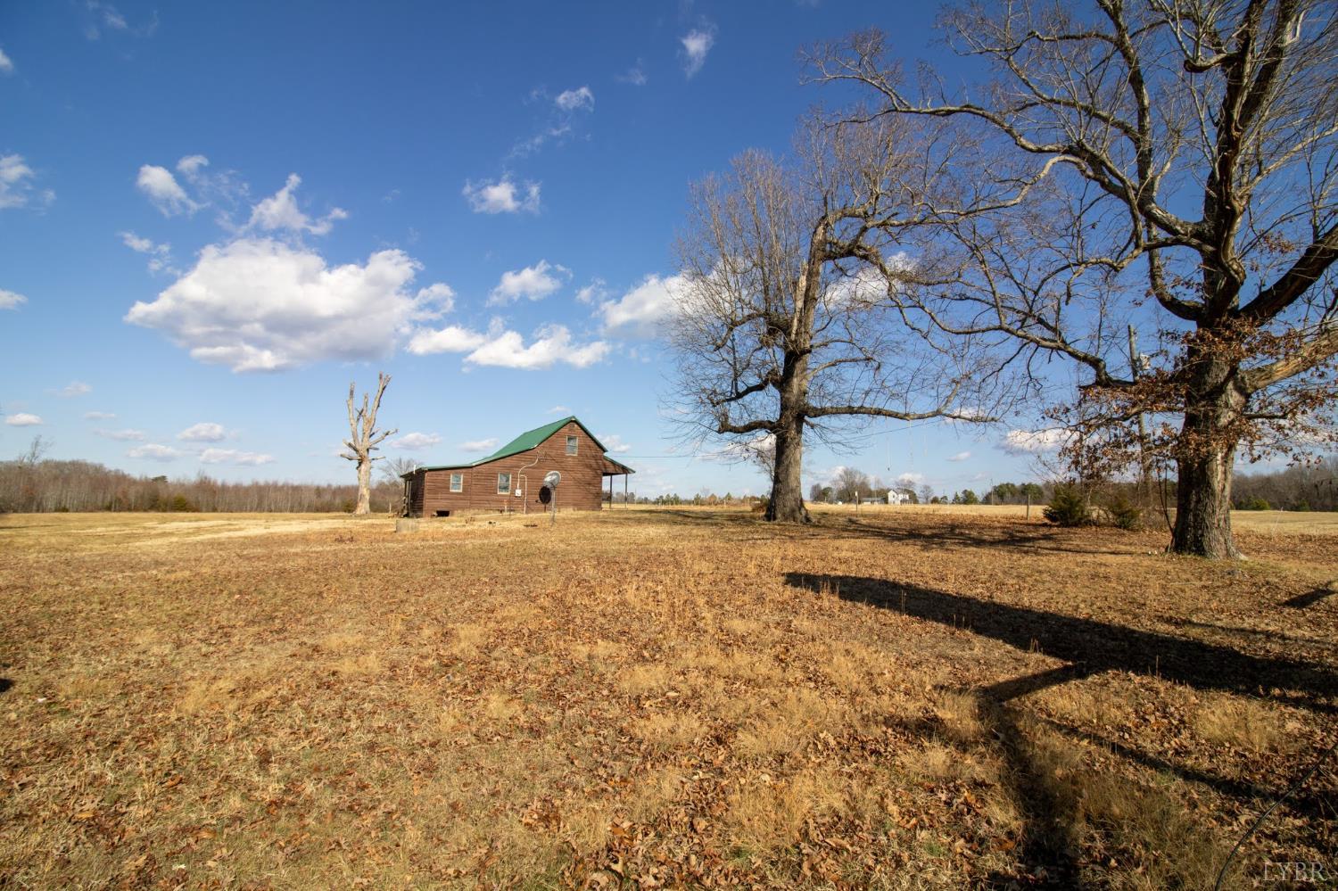 3039 T N Snow Road Nathalie, VA 24577 - Photo 34 of 50 a view of a house with a yard