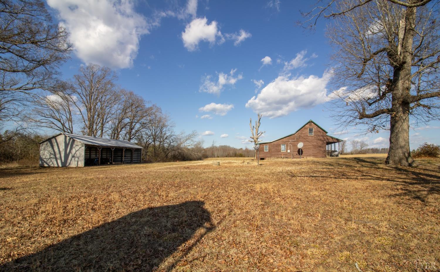 3039 T N Snow Road Nathalie, VA 24577 - Photo 37 of 50 a view of a house with a yard
