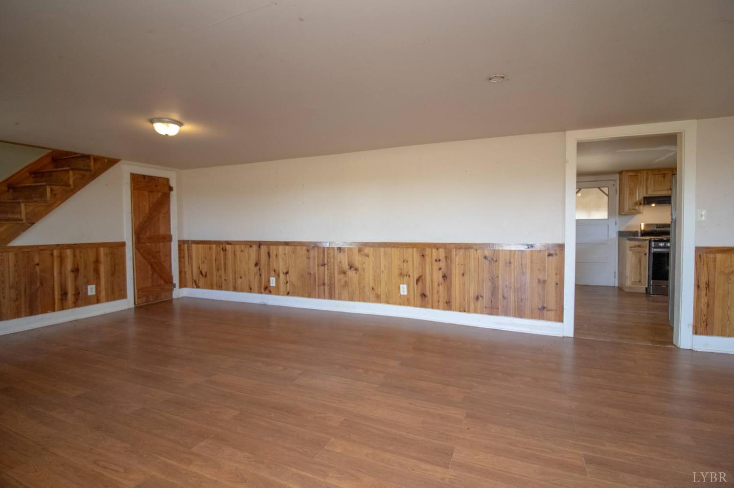 3039 T N Snow Road Nathalie, VA 24577 - Photo 6 of 50 a view of an empty room with wooden floor