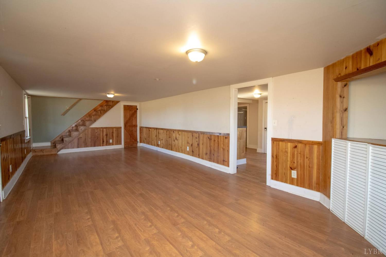 3039 T N Snow Road Nathalie, VA 24577 - Photo 8 of 50 a view of an empty room with wooden floor