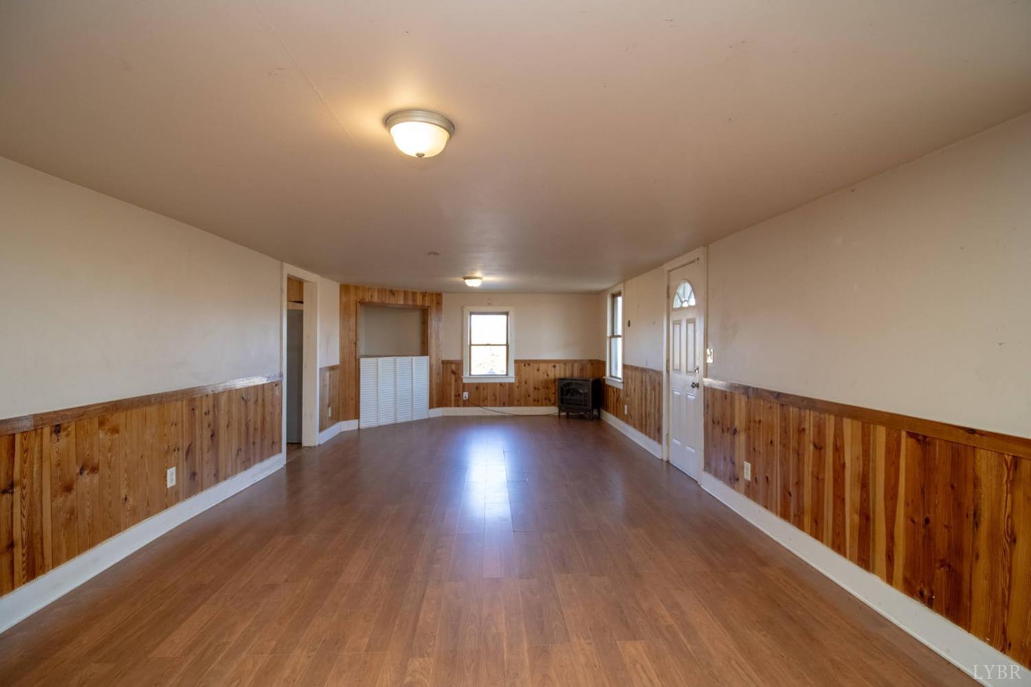 3039 T N Snow Road Nathalie, VA 24577 - Photo 9 of 50 a view of a big room with wooden floor