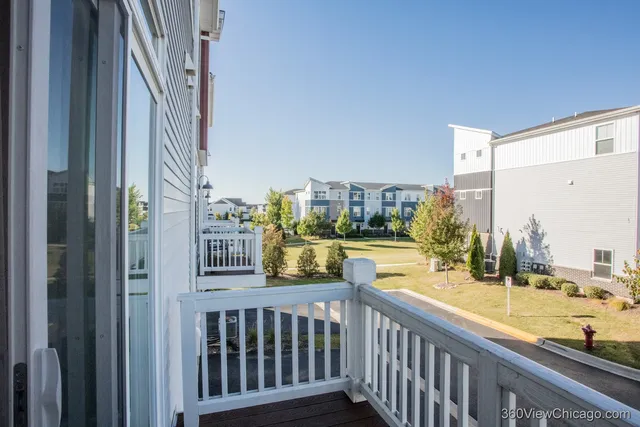 a view of balcony with furniture