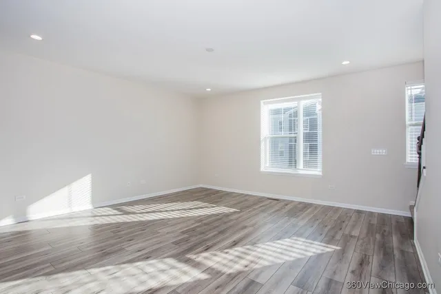 a view of kitchen with cabinets and wooden floor