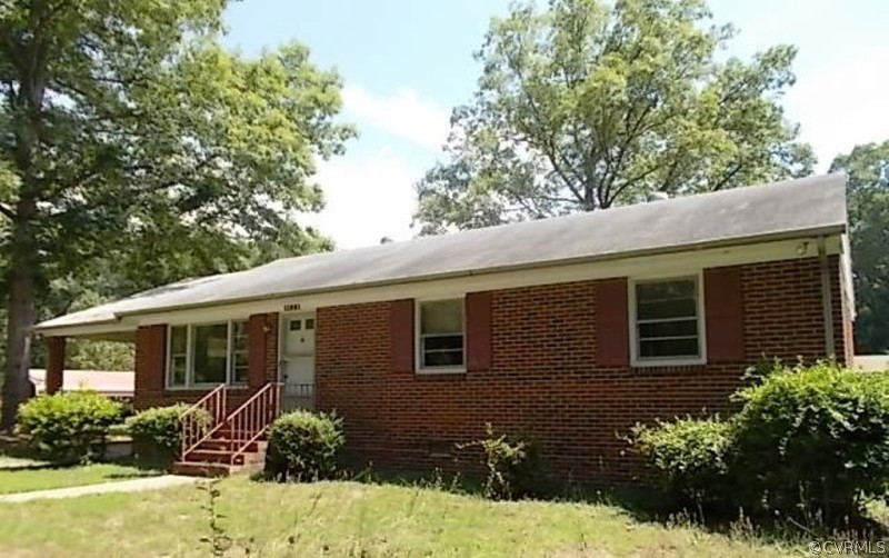 12801 Lewis Road Chester, VA 23831 - Photo 3 of 3 front view of a house with a yard