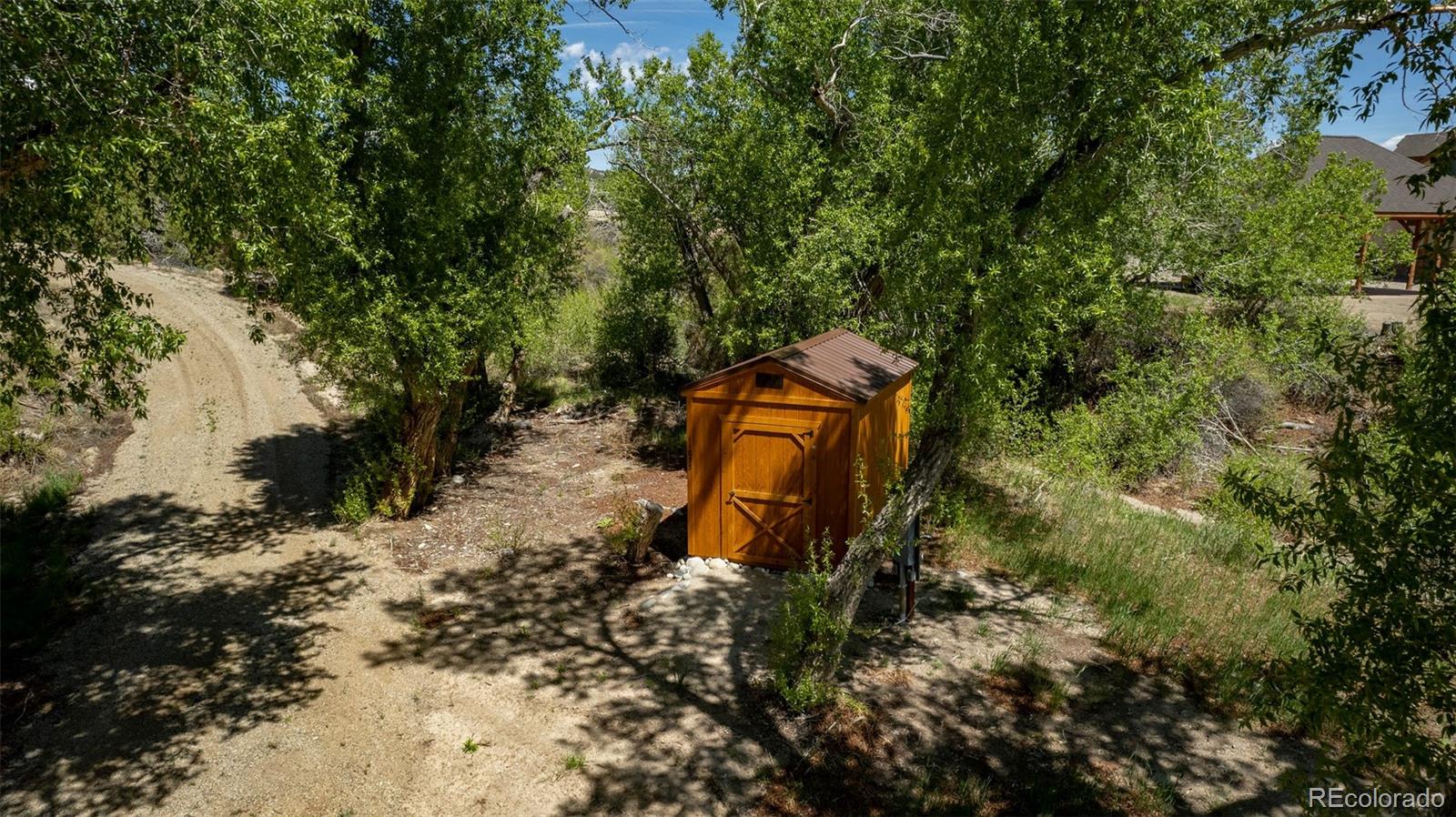 11033 Rivers Edge Lane Salida, CO 81201 - Photo 30 of 48 a backyard of a house with a yard and outdoor seating