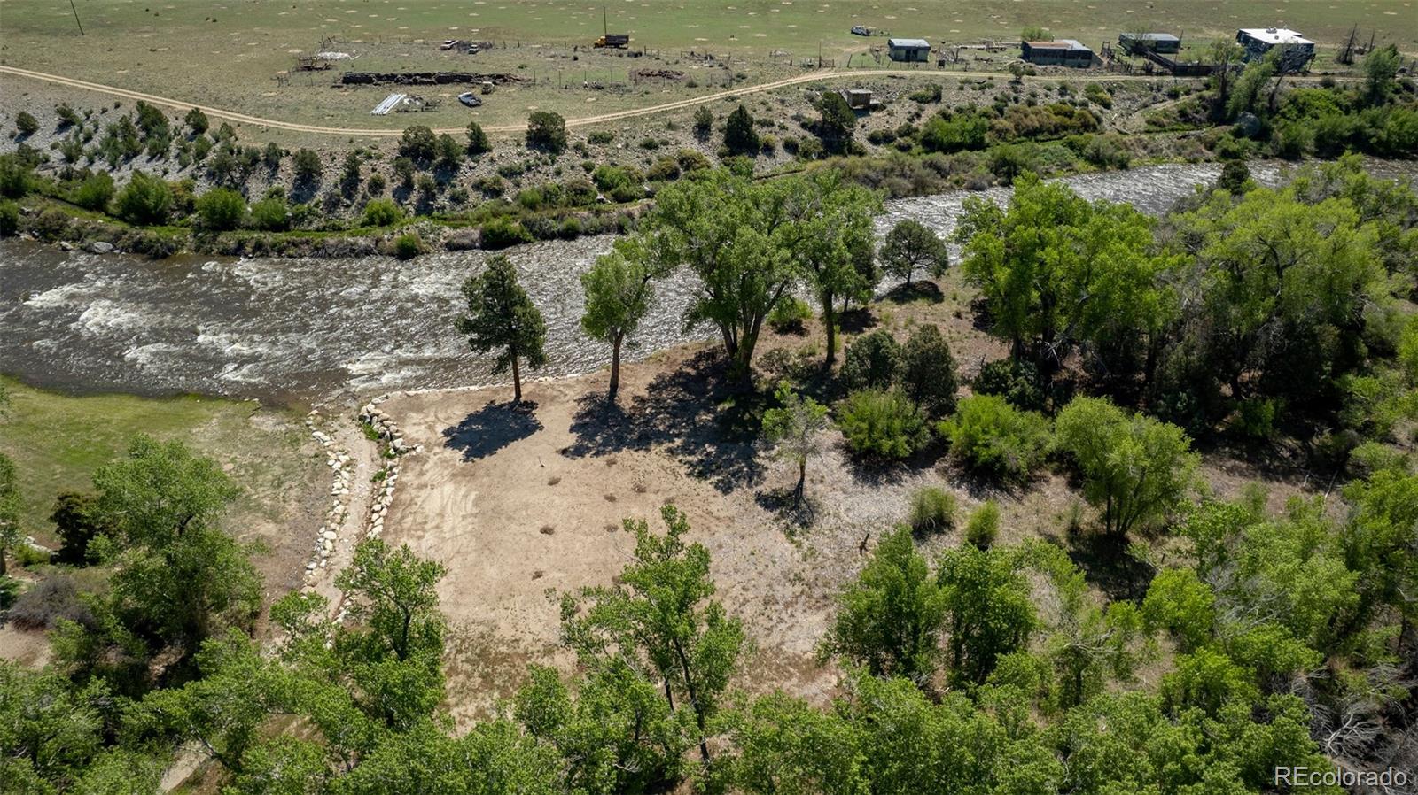 11033 Rivers Edge Lane Salida, CO 81201 - Photo 3 of 48 an aerial view of house with yard swimming pool and outdoor seating