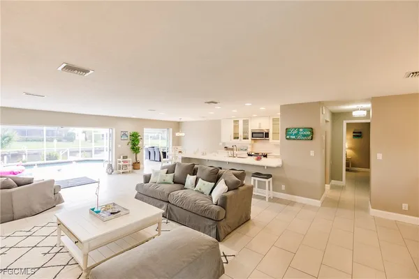 a living room with furniture and a table
