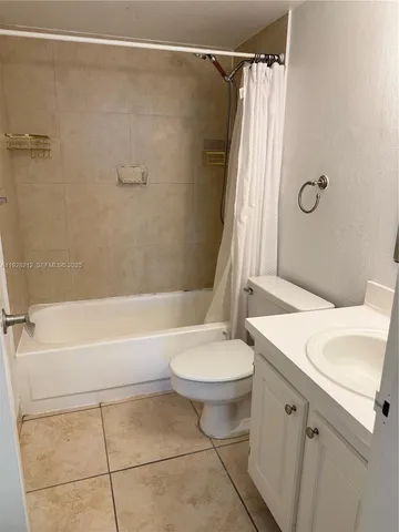 a bathroom with a sink a toilet and a bathtub