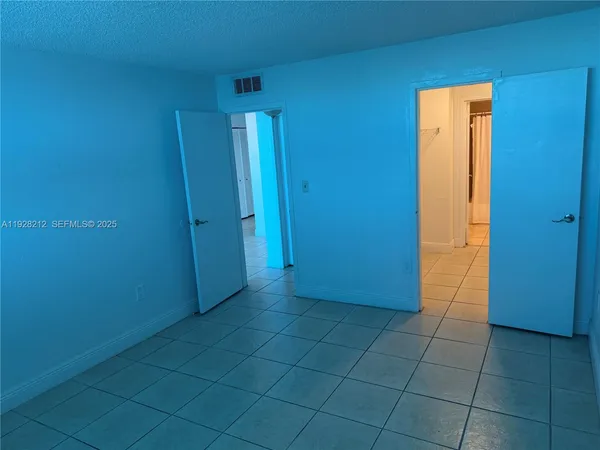 an empty room with a bathroom