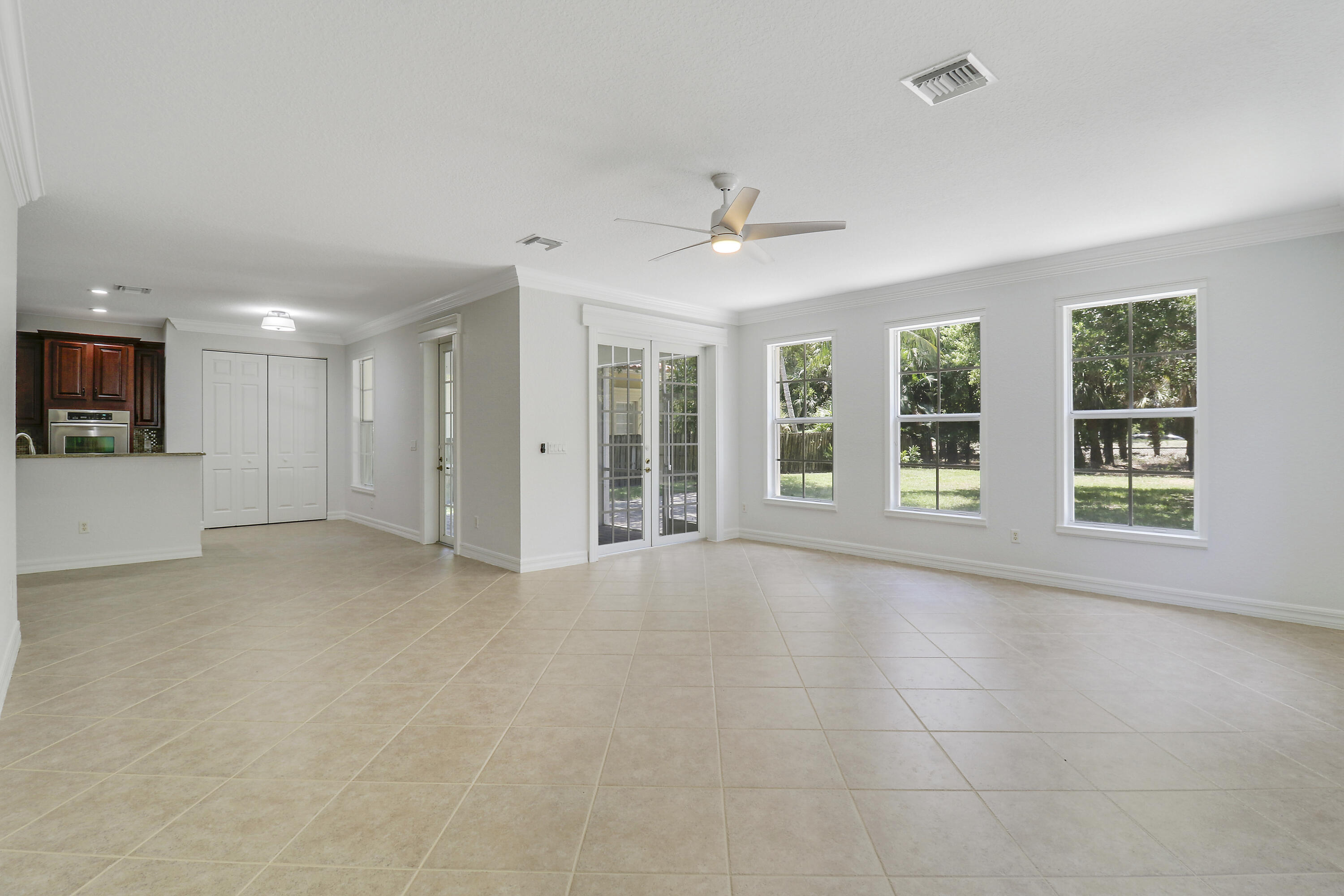 112 Dunmore Drive Jupiter, FL 33458 - Photo 13 of 43 French Doors to Screened Lanai