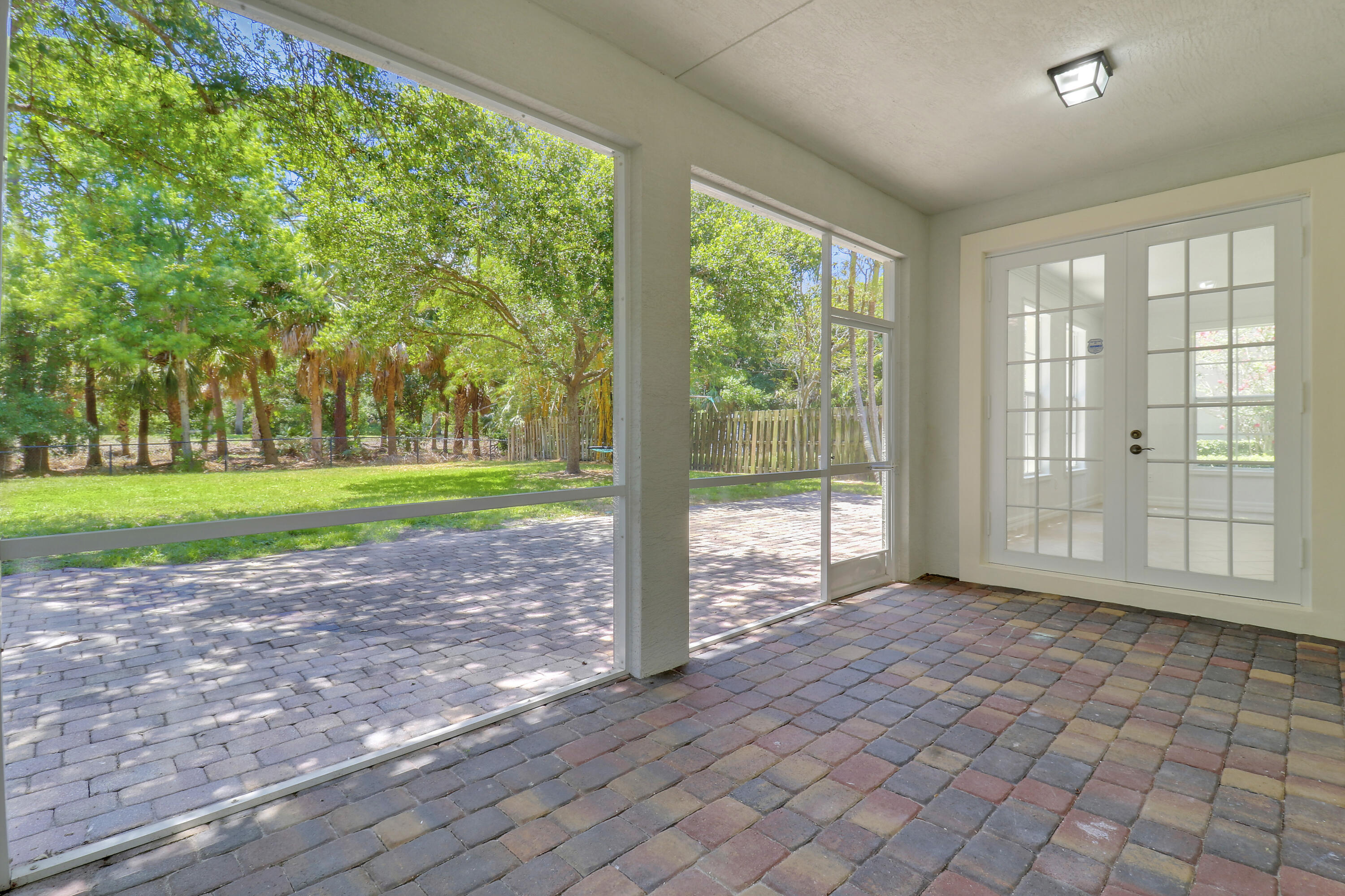 112 Dunmore Drive Jupiter, FL 33458 - Photo 17 of 43 French Doors to Great Room from Lanai