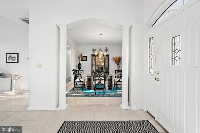 a kitchen with stainless steel appliances kitchen island granite countertop a refrigerator and microwave