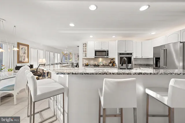 a spacious bedroom with a bed and a window