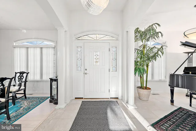 a view of living room filled with furniture and window