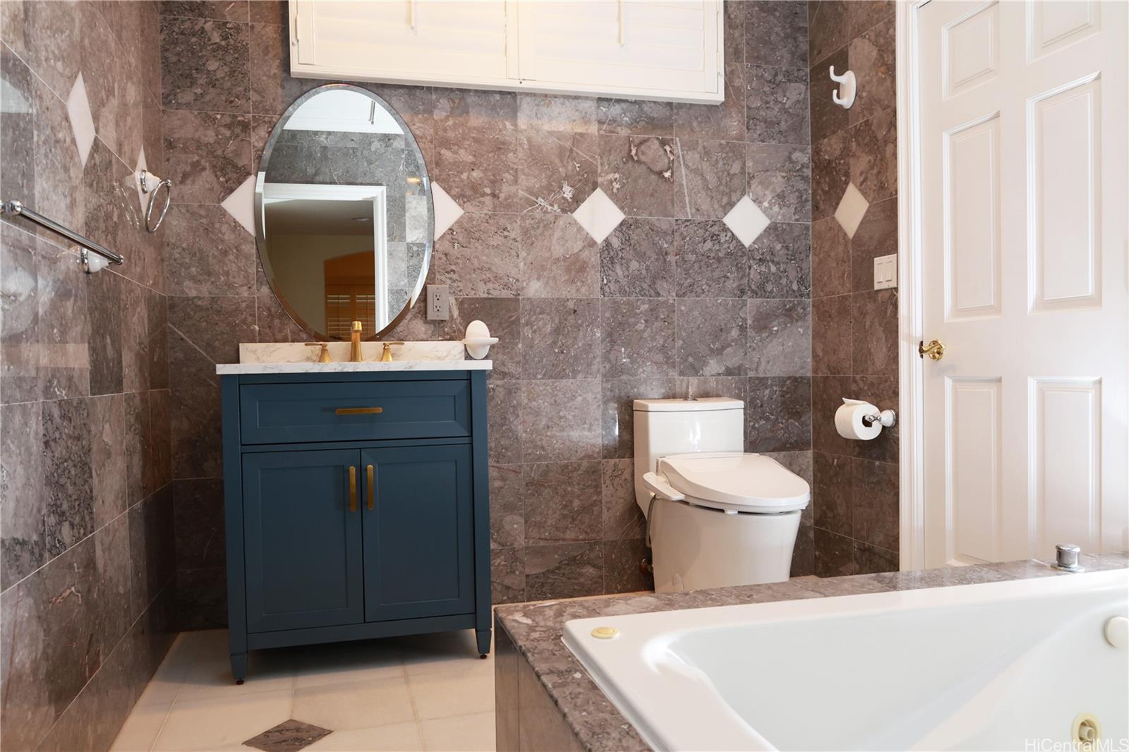 3063 Diamond Head Road Honolulu, HI 96815 - Photo 14 of 25 Ground floor bathroom offers a tub and shower.