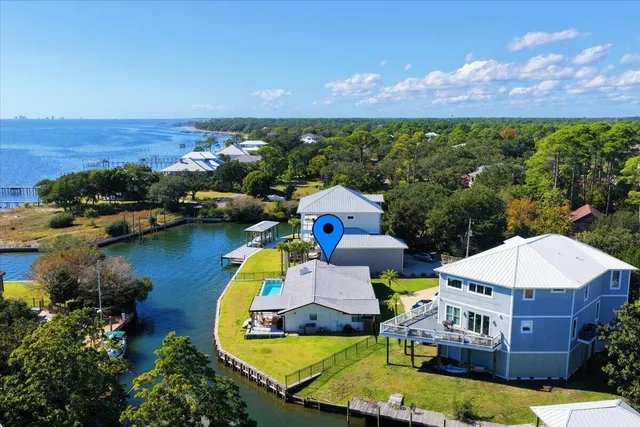 an aerial view of a house with a garden