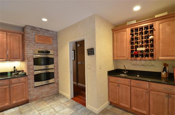 47 Pierpont Road Dudley, MA 01571 - Photo 11 of 30 a kitchen with stainless steel appliances a stove and a refrigerator