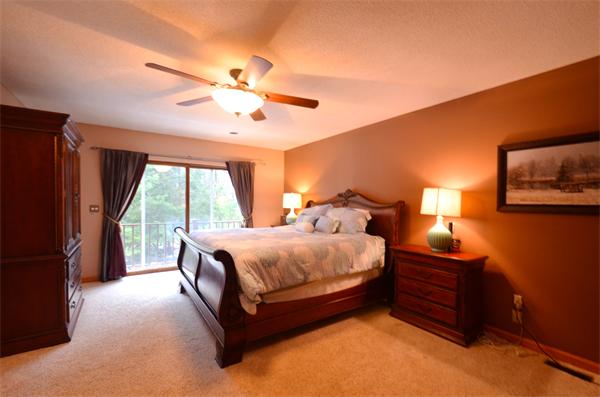47 Pierpont Road Dudley, MA 01571 - Photo 17 of 30 a spacious bedroom with a bed and a chandelier