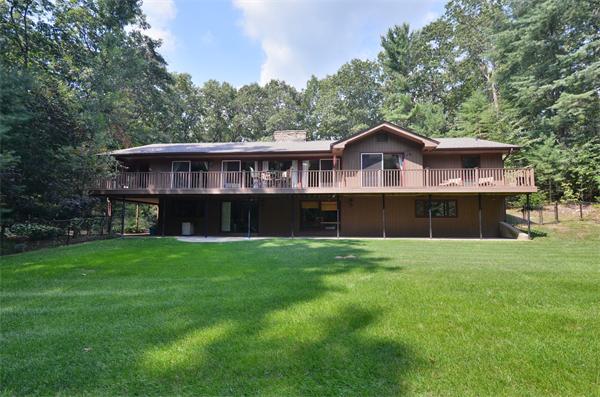 47 Pierpont Road Dudley, MA 01571 - Photo 2 of 30 a front view of a house with a yard and trees