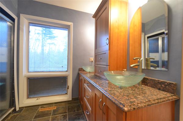 47 Pierpont Road Dudley, MA 01571 - Photo 21 of 30 a bathroom with a granite countertop sink and a mirror