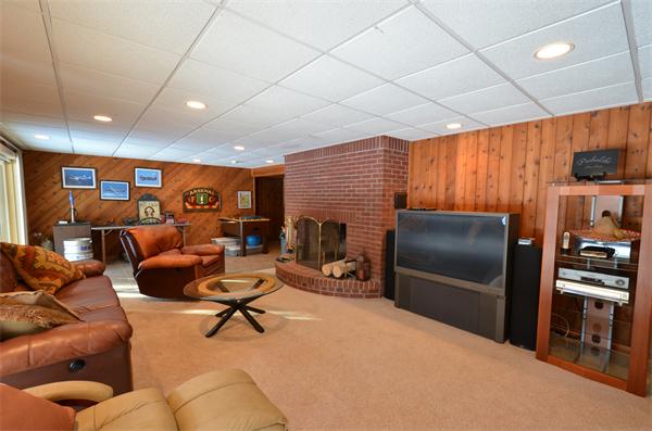 47 Pierpont Road Dudley, MA 01571 - Photo 25 of 30 a living room with furniture a projector and a flat screen tv