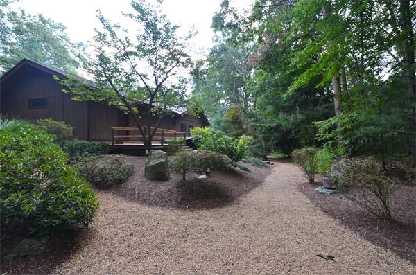 47 Pierpont Road Dudley, MA 01571 - Photo 6 of 30 a view of a backyard with plants and a patio
