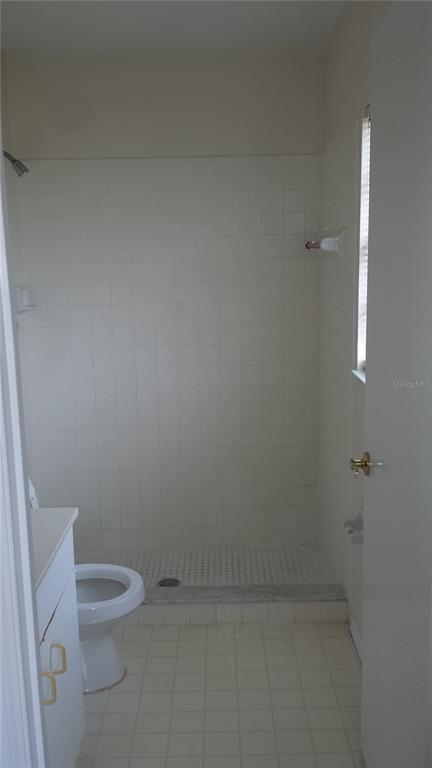 301 Oak Track Loop Ocala, FL 34472 - Photo 12 of 14 a bathroom with a toilet