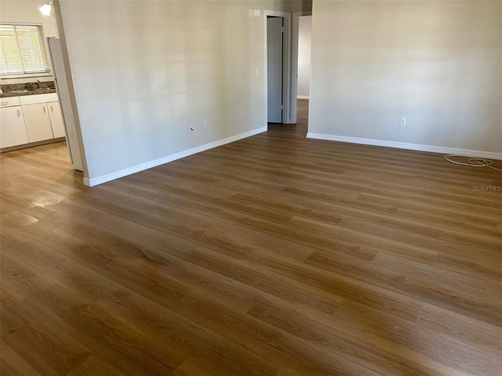 301 Oak Track Loop Ocala, FL 34472 - Photo 5 of 14 a view of a livingroom with wooden floor