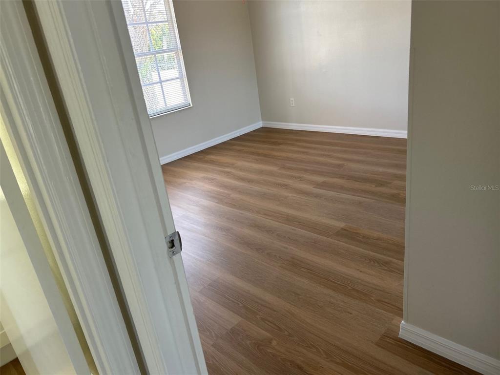 301 Oak Track Loop Ocala, FL 34472 - Photo 10 of 14 a view of empty room with wooden floor