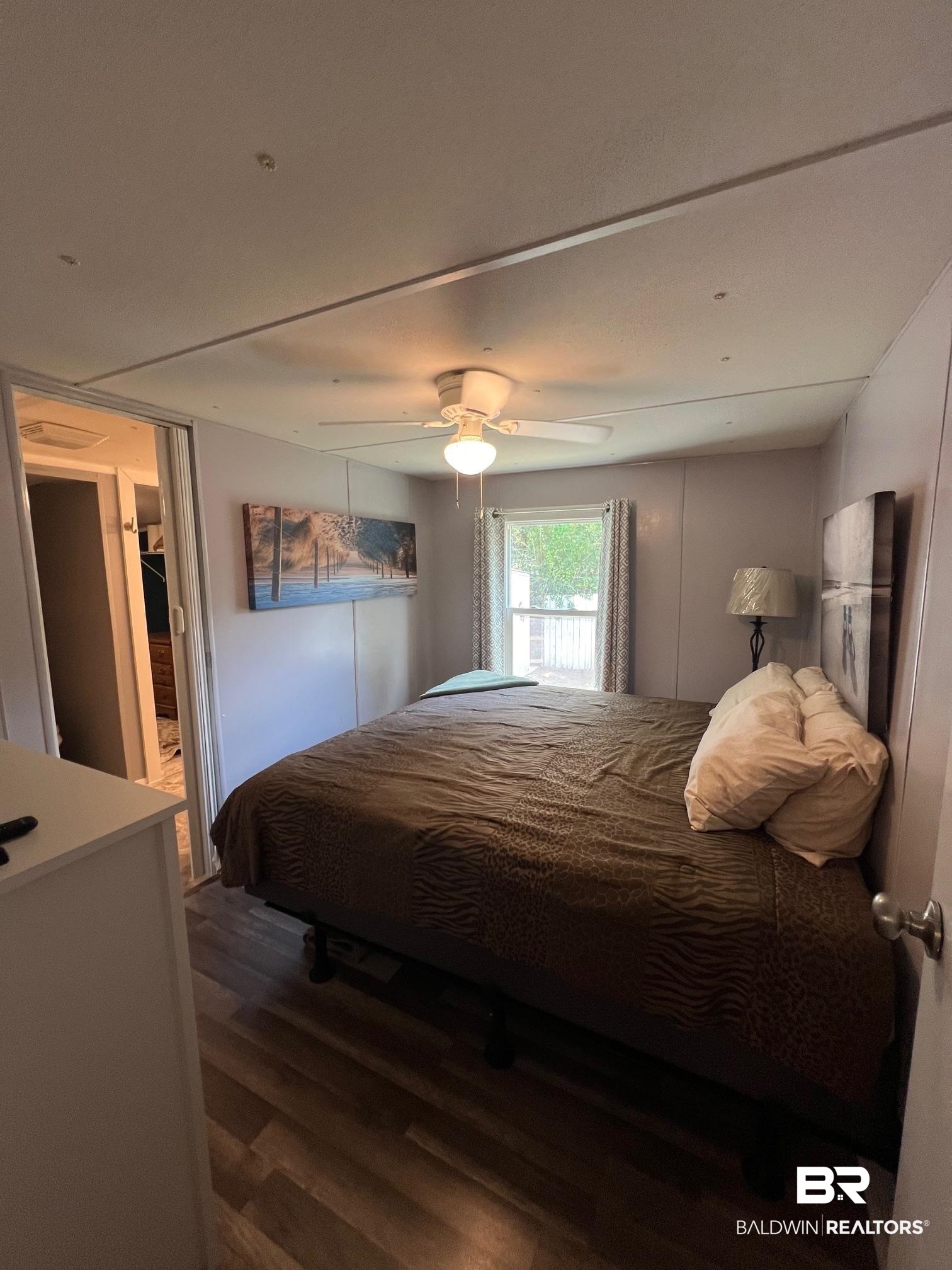 1420 Ridgewood Circle Lillian, AL 36549 - Photo 9 of 41 Bedroom with ceiling fan and dark hardwood / wood-style floors