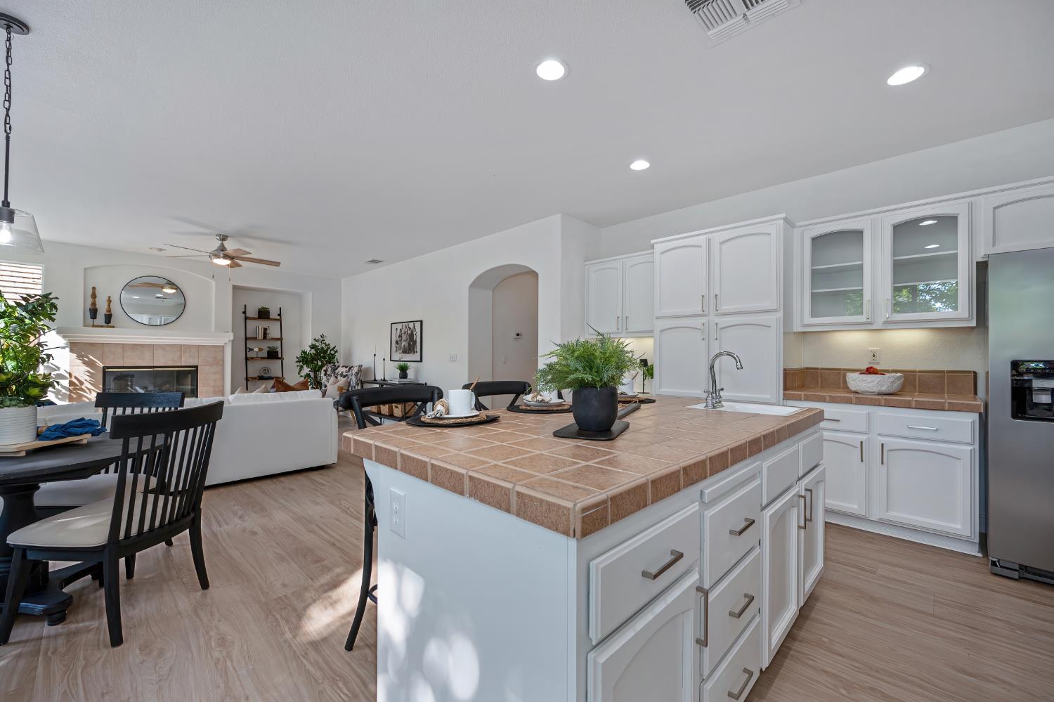 820 Travis Street Folsom, CA 95630 - Photo 12 of 47 a kitchen with sink cabinets and dining table