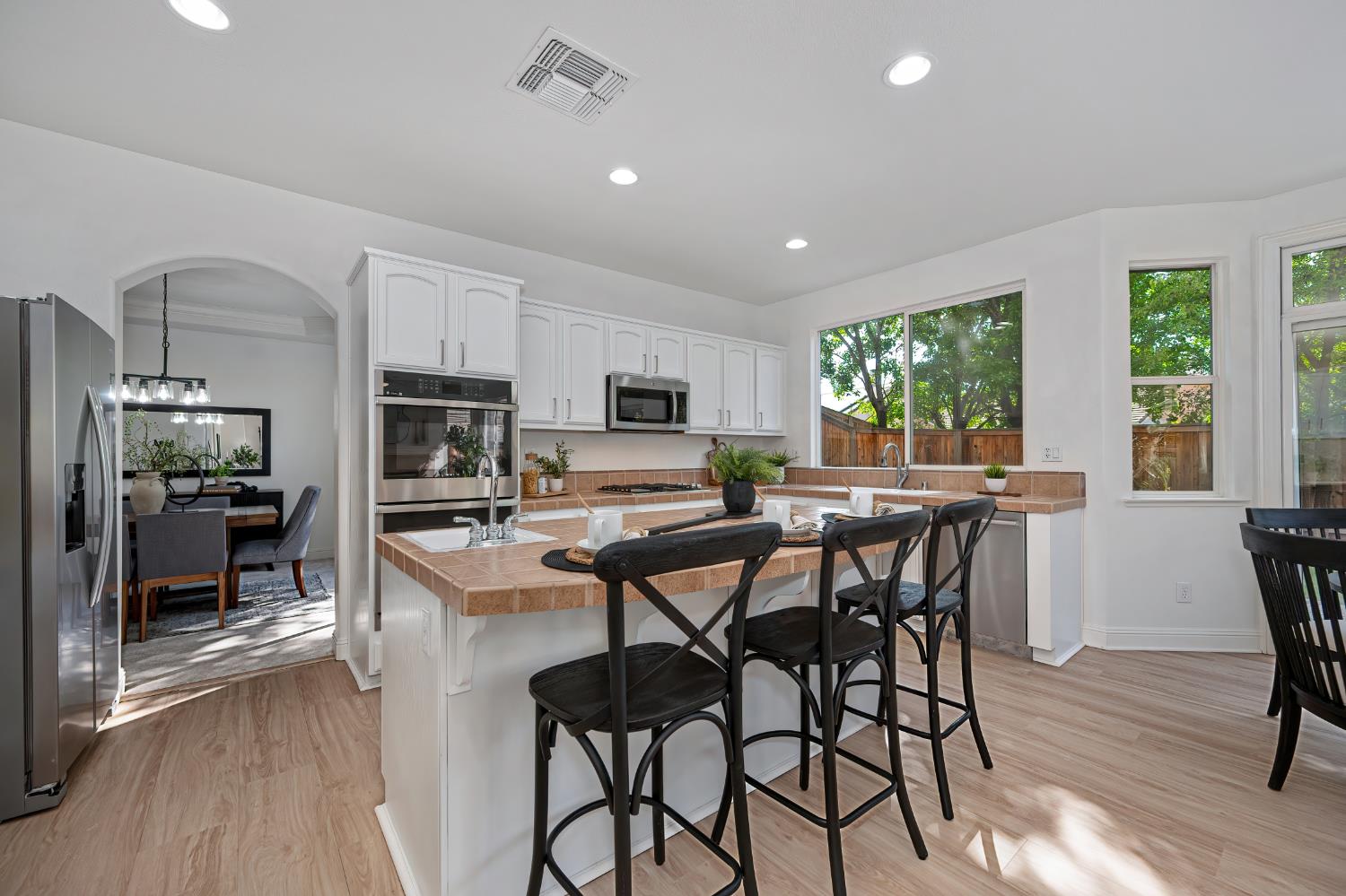 820 Travis Street Folsom, CA 95630 - Photo 14 of 47 a view of a dining room with furniture window and wooden floor