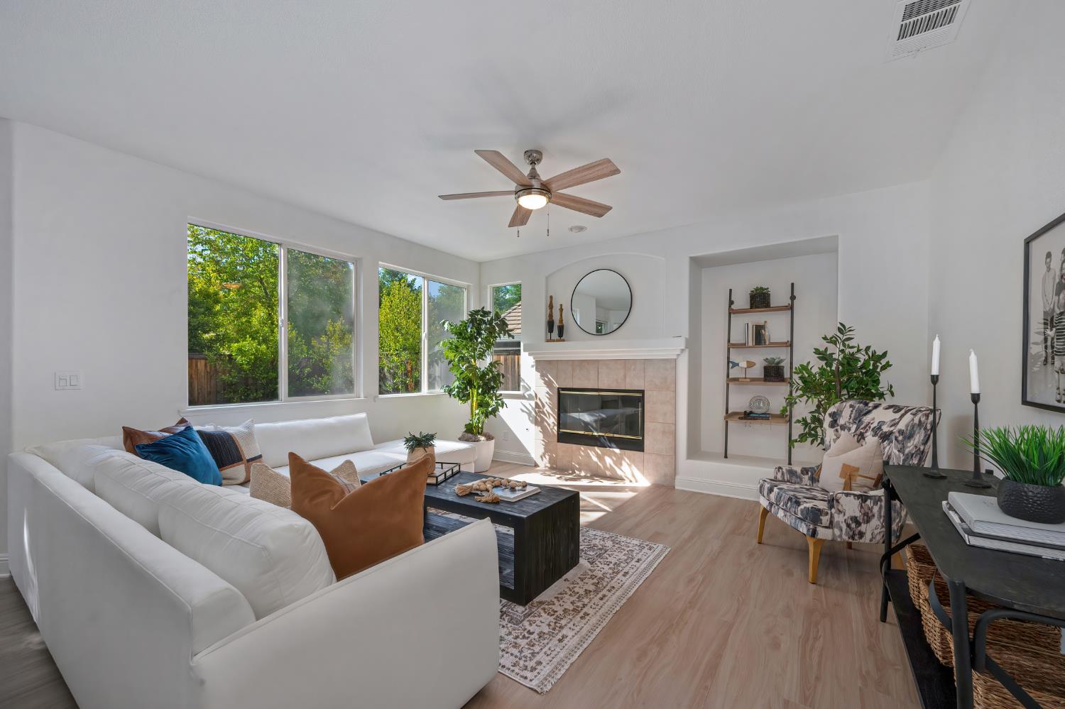 820 Travis Street Folsom, CA 95630 - Photo 17 of 47 a living room with furniture a fireplace and a large window