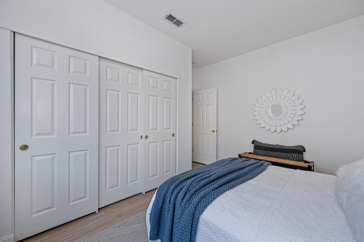 820 Travis Street Folsom, CA 95630 - Photo 22 of 47 a bedroom with a bed and wooden floor