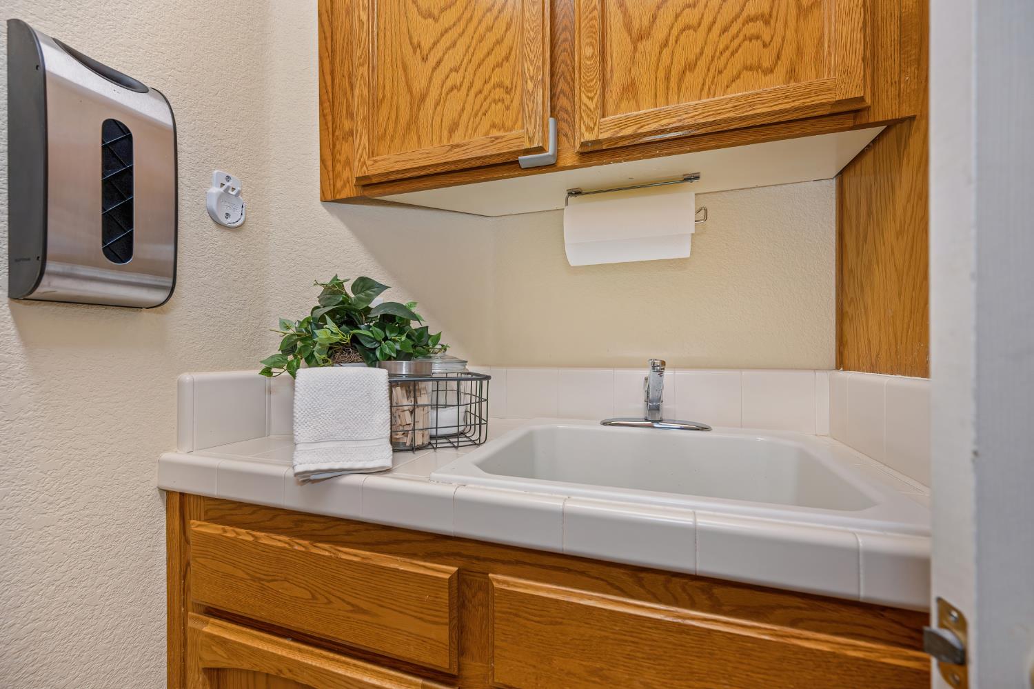 820 Travis Street Folsom, CA 95630 - Photo 24 of 47 a bathroom with a sink and a mirror