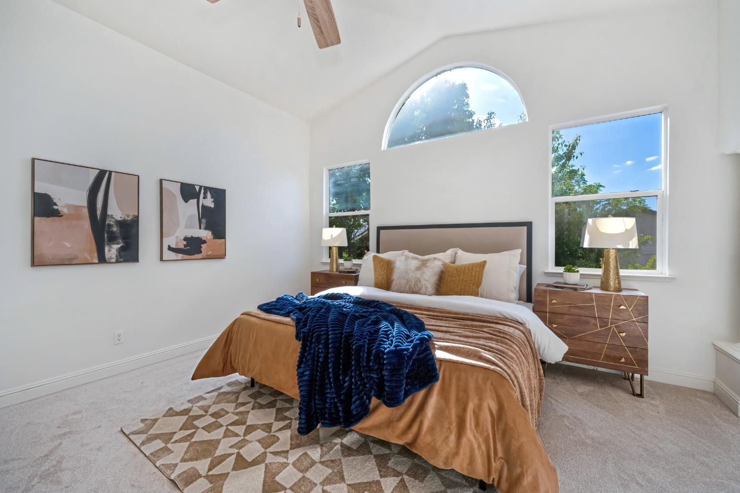 820 Travis Street Folsom, CA 95630 - Photo 27 of 47 a bedroom with a large bed and a chandelier