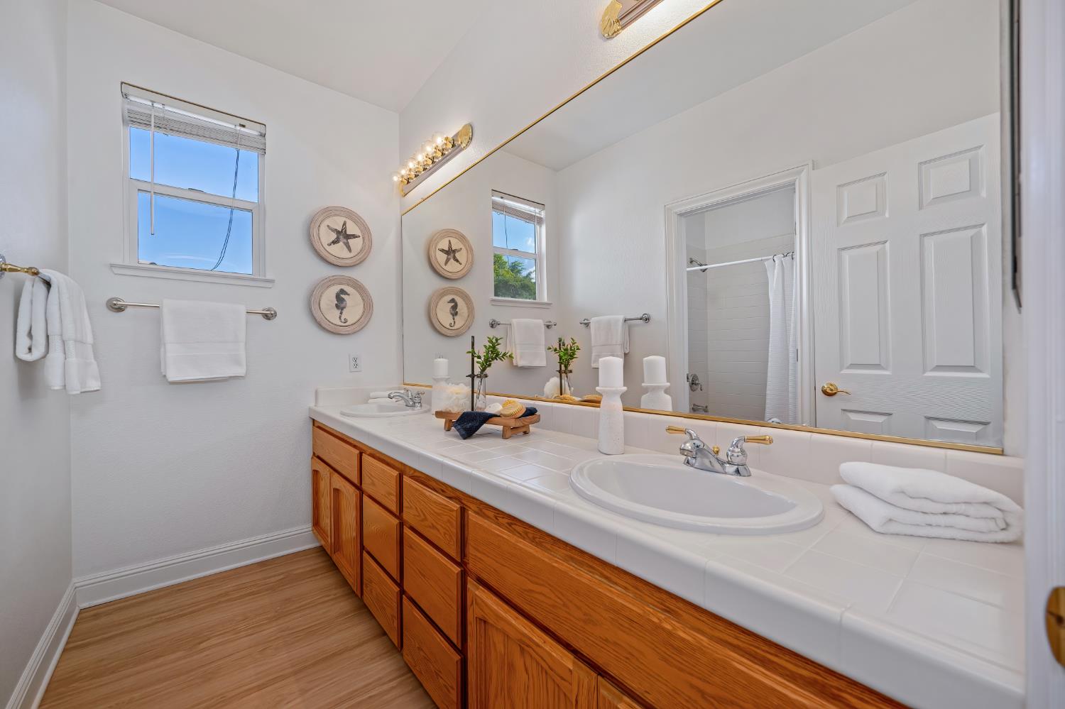 820 Travis Street Folsom, CA 95630 - Photo 37 of 47 a bathroom with a sink and a mirror