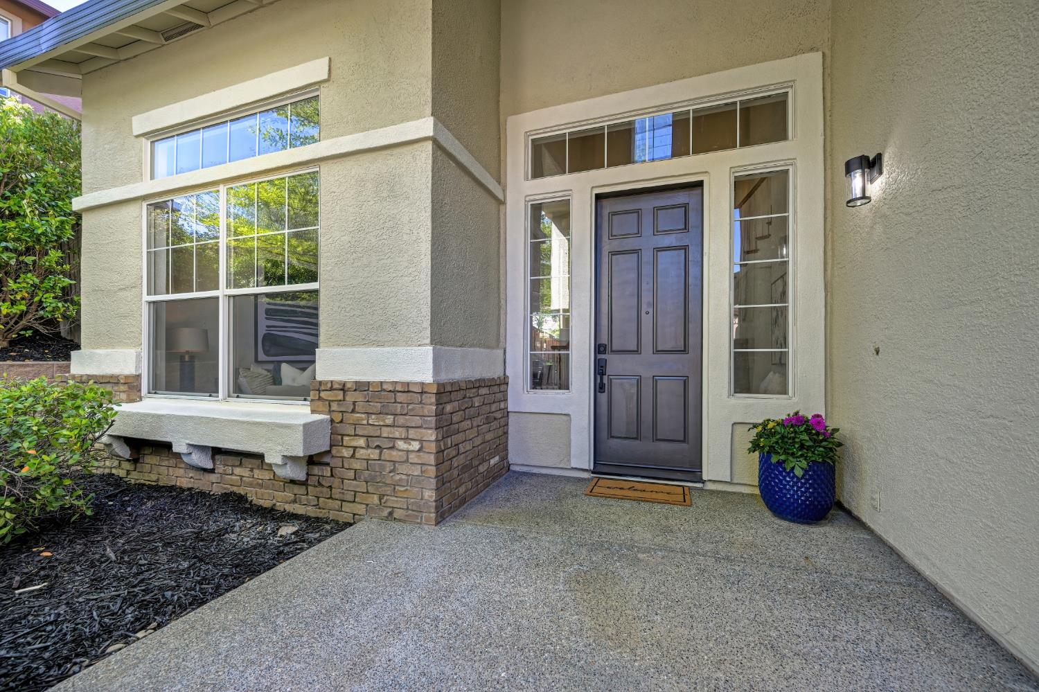820 Travis Street Folsom, CA 95630 - Photo 4 of 47 a front view of a house with a garden