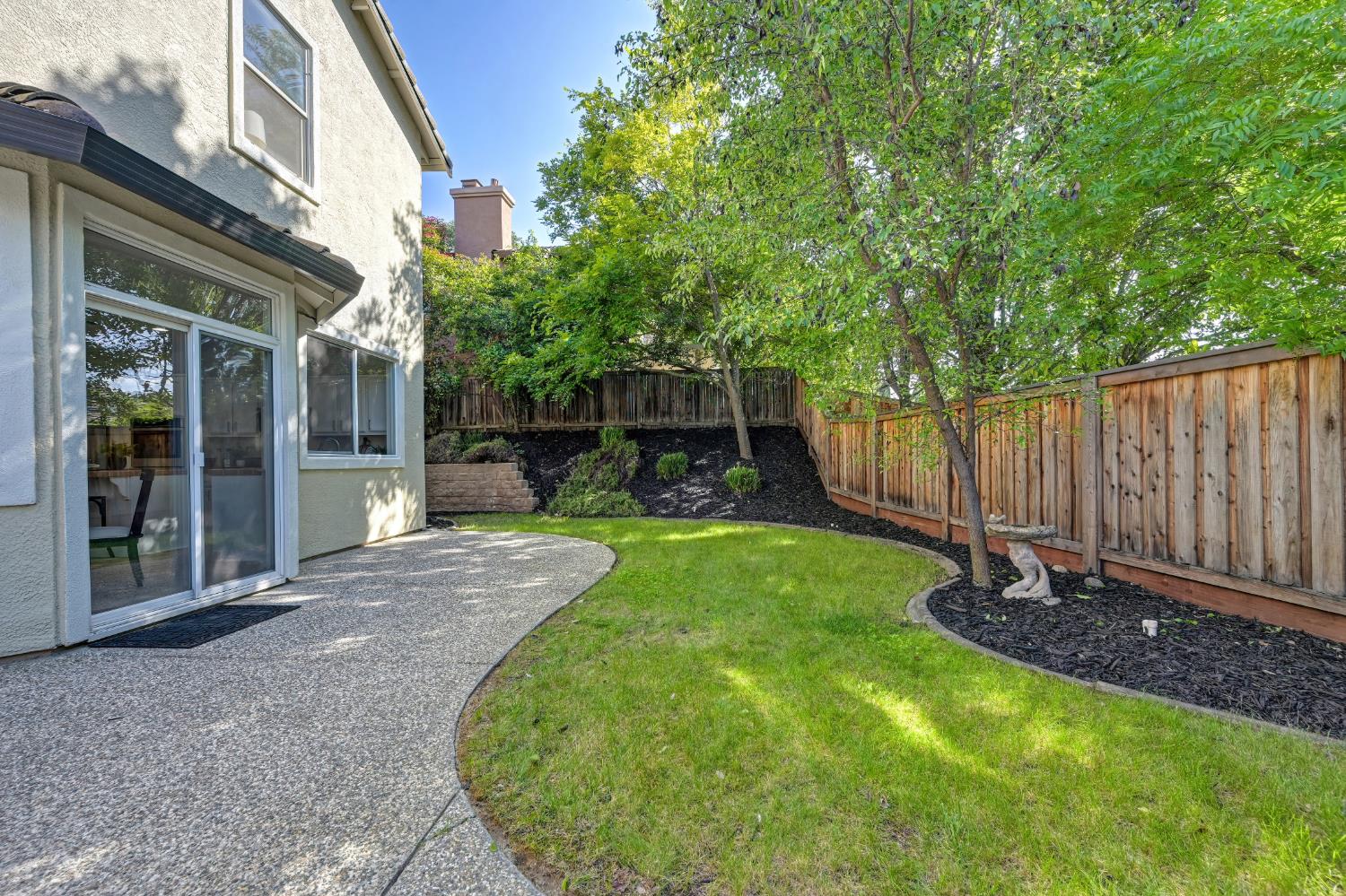 820 Travis Street Folsom, CA 95630 - Photo 45 of 47 a view of a backyard with a garden