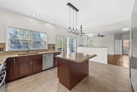 a bedroom with a large bed and a large window