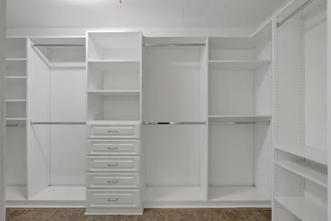 a bathroom with double vanity and a mirror or bathtub