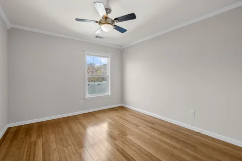 a view of backyard with deck and garden