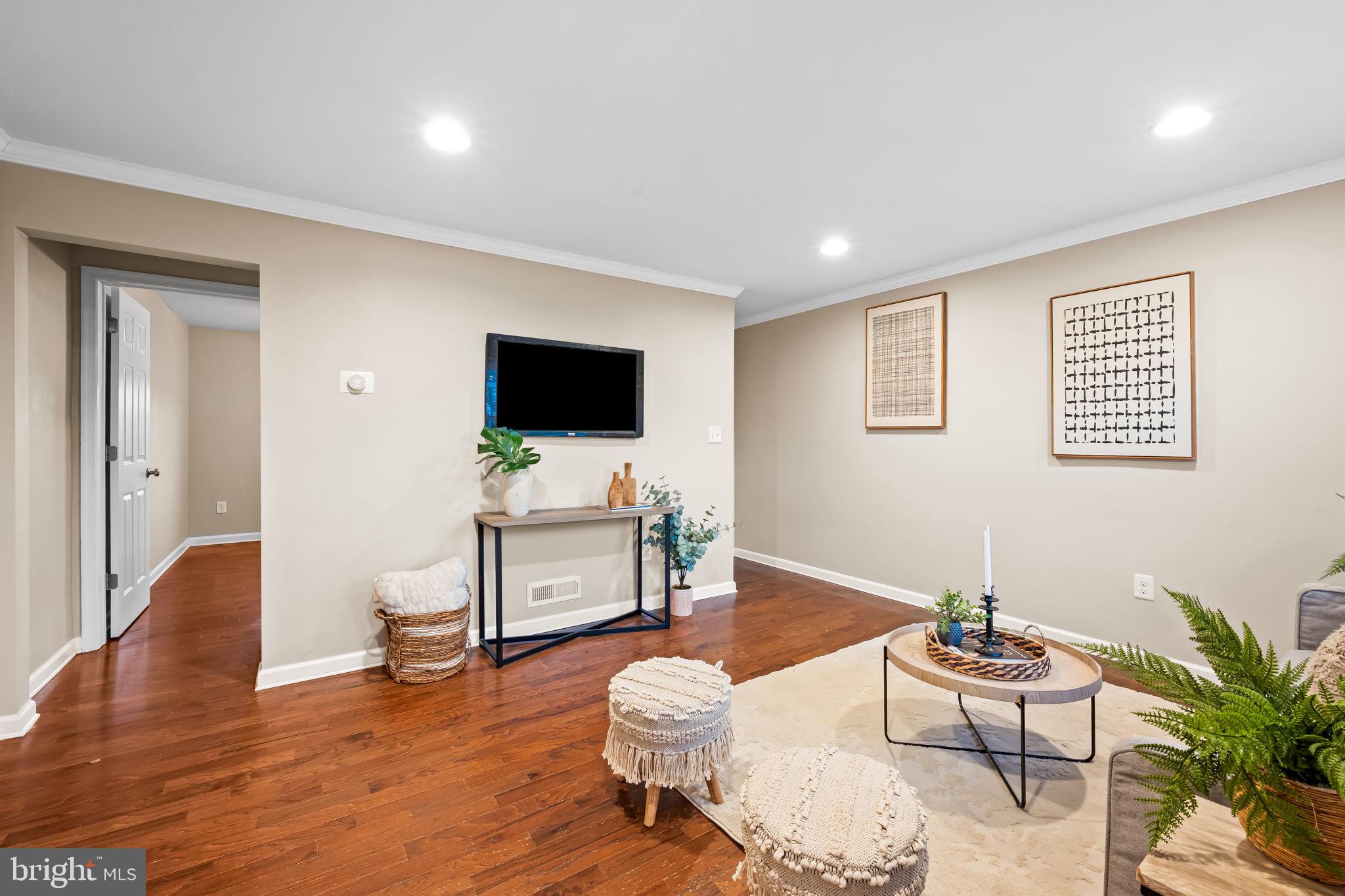 1817 Dunmere Road Baltimore, MD 21222 - Photo 6 of 27 a living room with furniture and a flat screen tv