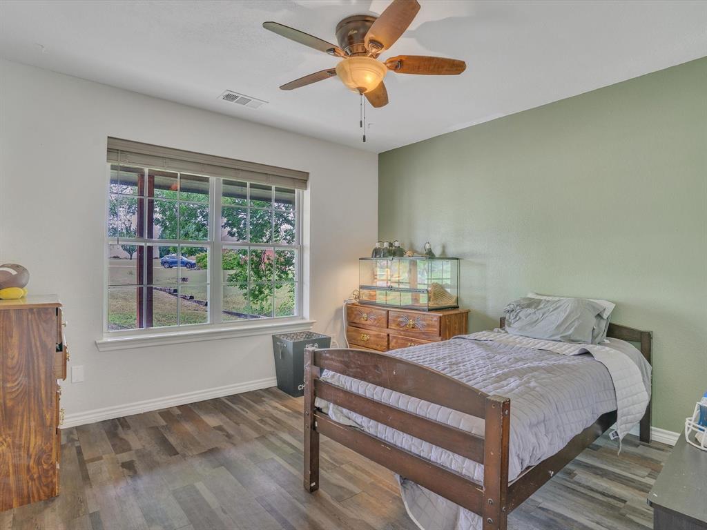15067 Meadow Ridge Court Nevada, TX 75173 - Photo 14 of 39 a bedroom with a bed and a window