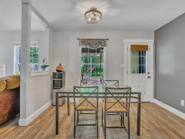 a dining room with furniture and window