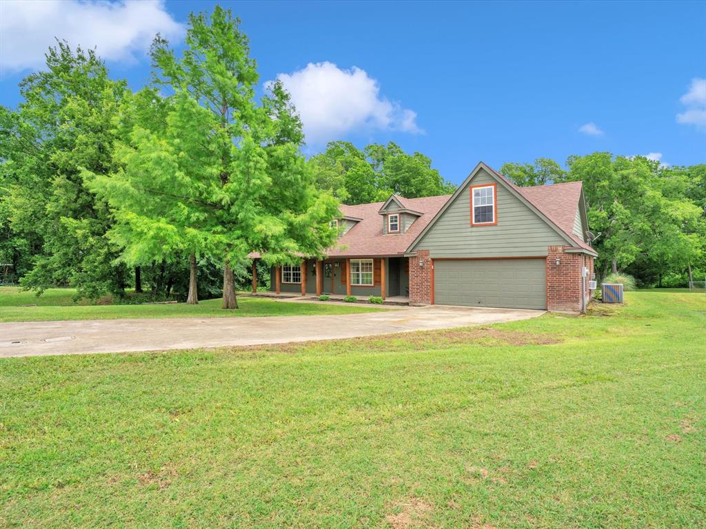 15067 Meadow Ridge Court Nevada, TX 75173 - Photo 3 of 39 a front view of a house with a yard