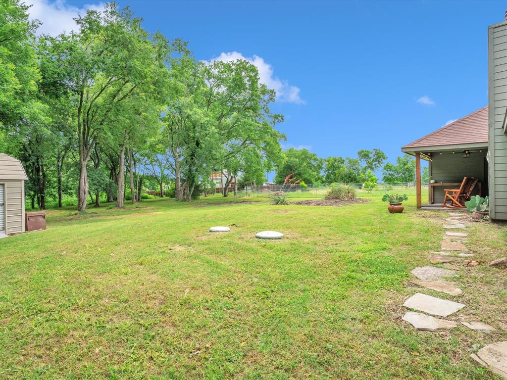 15067 Meadow Ridge Court Nevada, TX 75173 - Photo 34 of 39 a view of a park with large trees and a big yard