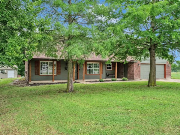 front view of a house with a yard