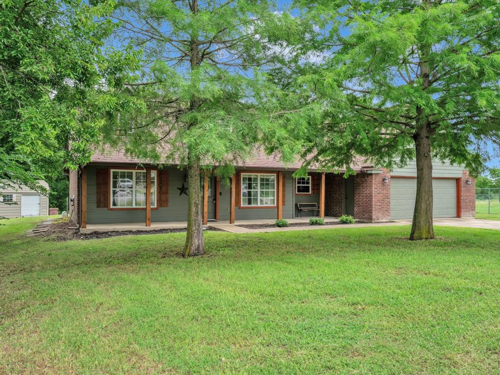 15067 Meadow Ridge Court Nevada, TX 75173 - Photo 4 of 39 front view of a house with a yard